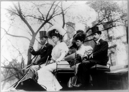 Mr. and Mrs. Goadby Loew riding in open carriage with a man and two other women LCCN96503942