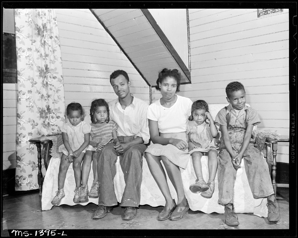 Mr. and Mrs. James Robert Howard and their four children. They live in a three room house of a two-family house, the... - NARA - 540779