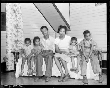 Mr. and Mrs. James Robert Howard and their four children. They live in a three room house of a two-family house, the... - NARA - 540779