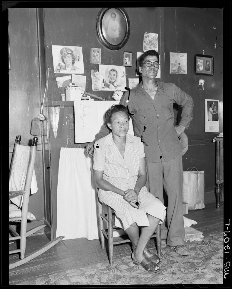 Mr. and Mrs. Lonnie Davis in one of their four rooms Linoleum for floors are one of the first evidence of increased... - NARA - 540726