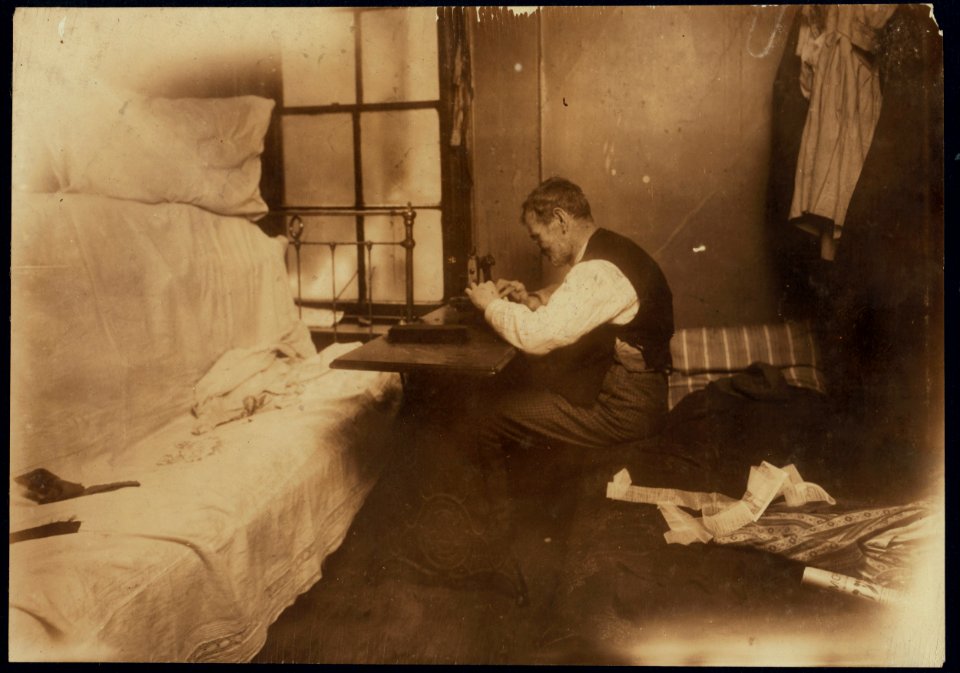 Mr. Rothenberg stitching neckties in small inner bed-room. See photo and label 2877. LOC nclc.04197