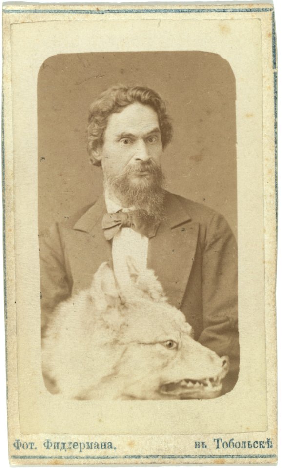 Mr. Znamenski, half-length portrait, facing left, holding stuffed head of a wolf in his lap LCCN99615517