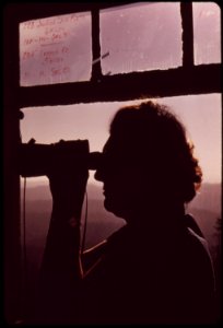 Mrs-lois-carlson-looks-through-telescope-in-the-tower-120-feet-above-ground-september-1973 7006981762 o