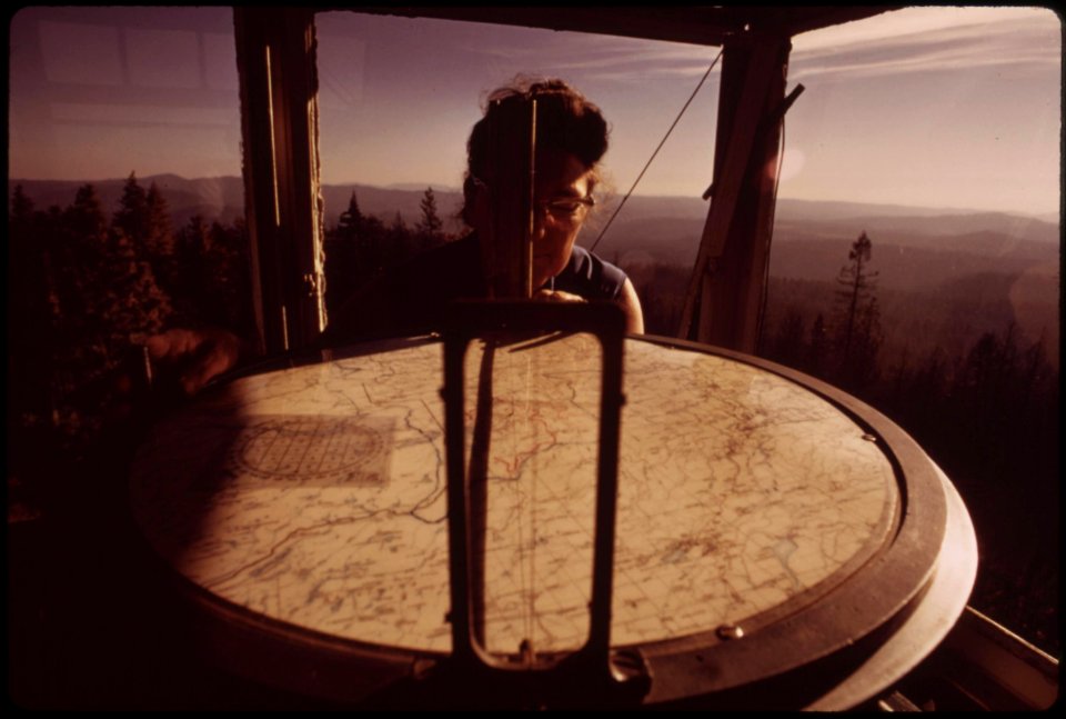 Mrs-lois-carlson-looks-at-the-fire-finder-in-the-tower-which-was-evacuated-during-the-emergency-september-1973 7006980824 o