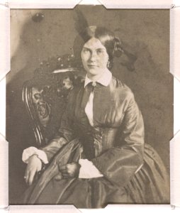 Mrs. Edwin Booth (Mary Devlin), three-quarter length studio portrait, seated with right hand resting on the arm of the chair and left hand on lap, facing front LCCN2015651560