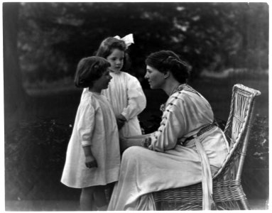 Mrs. Frank Vanderlip seated on porch, with two children LCCN97505392