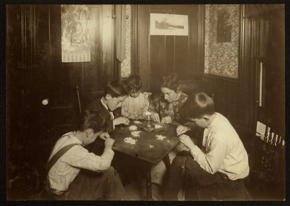 Mrs. Gay, 33 James Street, Attleboro, Mass., and children - 5, 7, 12, and 13 years old, setting stones in cheap jewelry. There were 244 stones in this lot. She said they earned about $5 a LOC nclc.05579