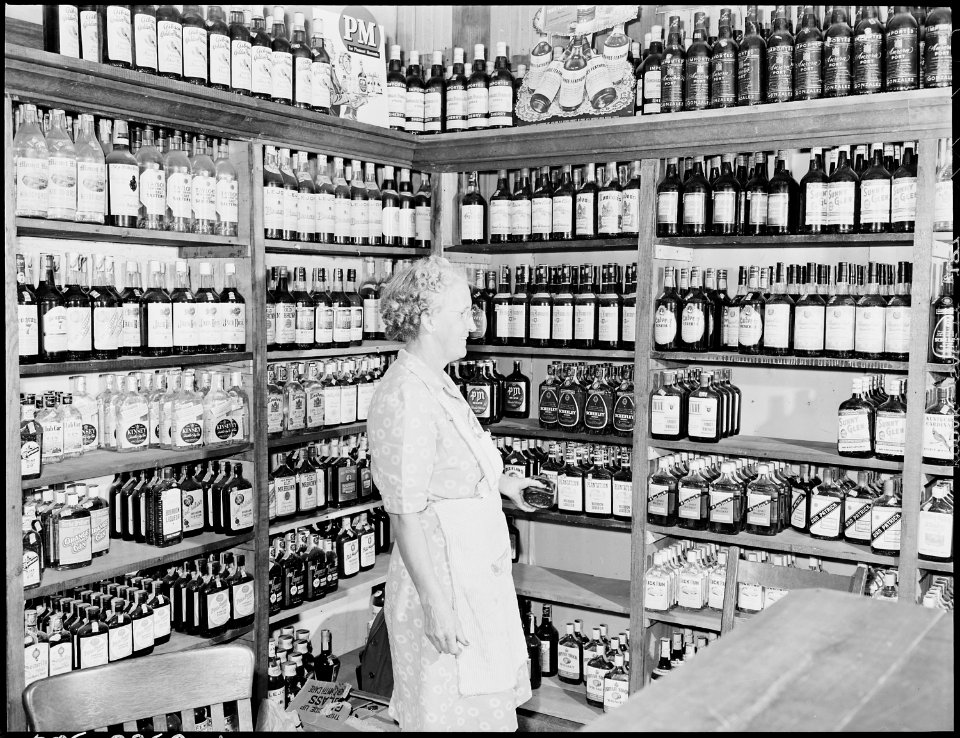 Mrs. Fred Blackburn, wife of proprietor of liquor store. Mr. Blackburn was former official at Wheelwright Mines.... - NARA - 541425