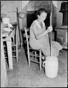 Mrs. Dillard Eldridge churning. Kentucky Straight Creek Coal Company, Belva Mine, abandoned after explosion (in) Dec.... - NARA - 541211