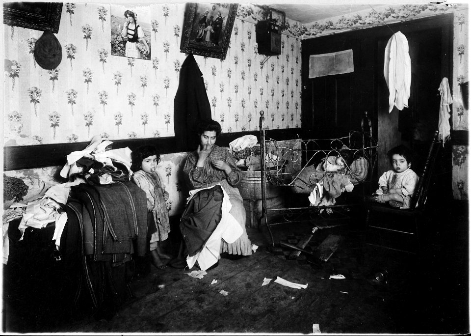 Mrs. Guadina, living in a dirty, poverty stricken home. On the trunk is the work of 4 days. She was struggling along... - NARA - 523517