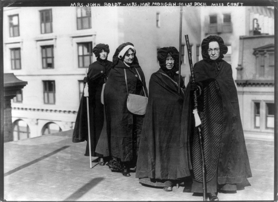 Mrs. John Boldt, Mrs. May Morgan, Miss Dock and Miss Craft (holding Votes for Women staff) LCCN2002714477