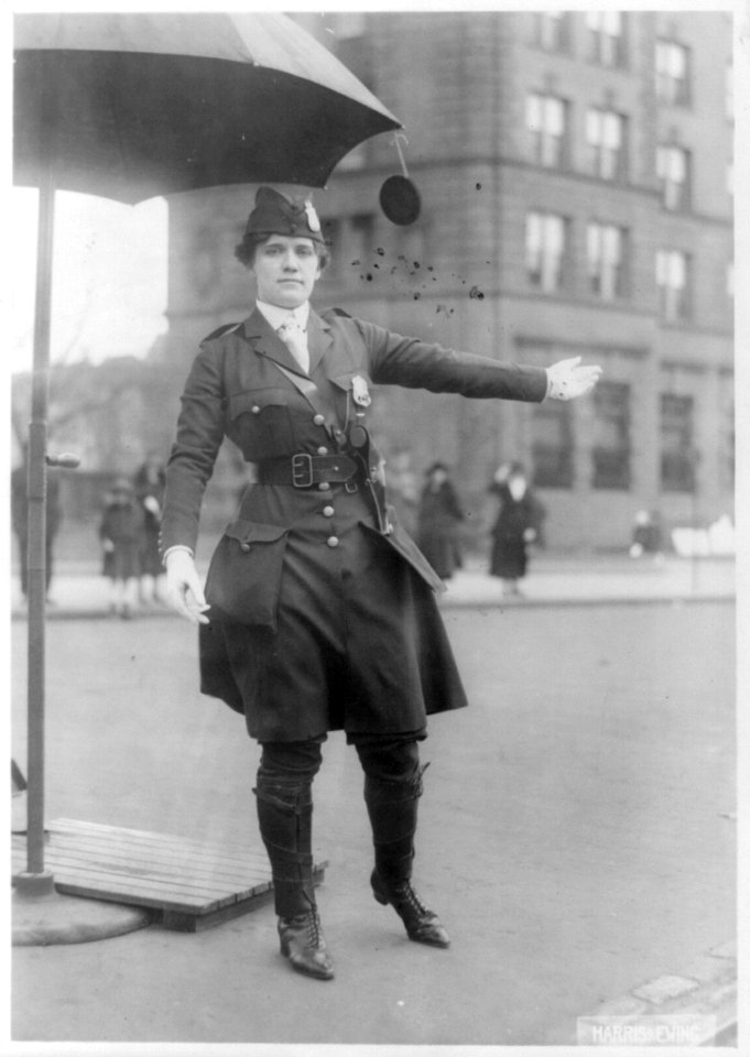 Mrs. L.A. King, full, standing, directing traffic as policewoman LCCN2006685714