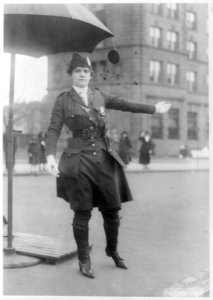 Mrs. L.A. King, full, standing, directing traffic as policewoman LCCN2006685714