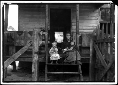 Mrs. L. Bosher, living in a run down cotton mill village. Her husband has been a mill hand here for a long time but... - NARA - 523437