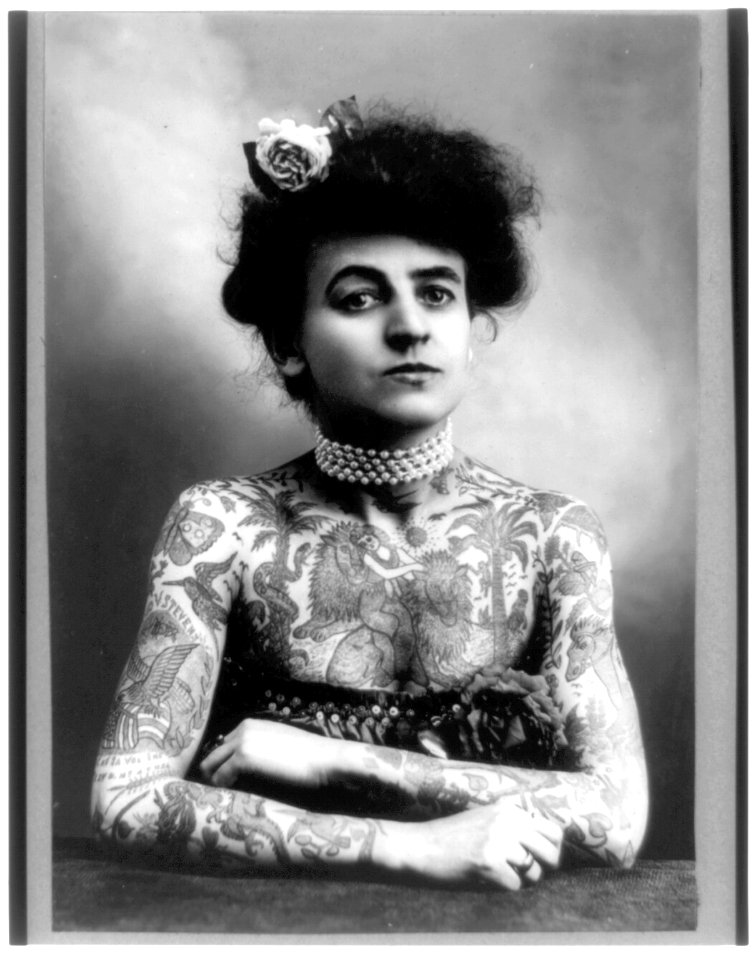 Mrs. M. Stevens Wagner, half length portrait, facing slightly right, arms and chest covered with tattoos LCCN2002724032