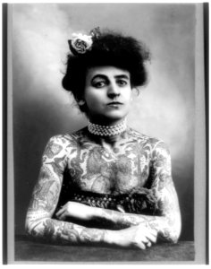 Mrs. M. Stevens Wagner, half length portrait, facing slightly right, arms and chest covered with tattoos LCCN2002724032