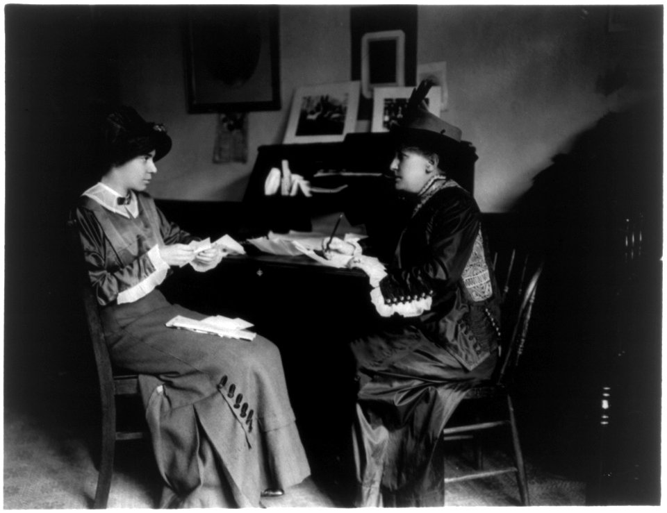 Mrs. Helen Gardener and Miss Alice Paul, seated, full-length portrait, at desk LCCN96524618 photo