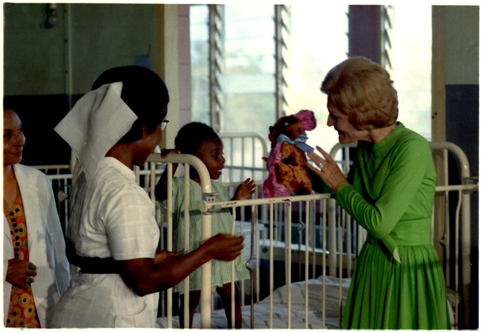 Mrs. Nixon visits with a child in a hospital in Ghana - NARA - 194404
