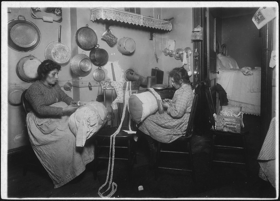 Mrs. Palontona and 13 year old daughter, working on pillow-lace in dirty kitchen of their tenement home. They were... - NARA - 523503