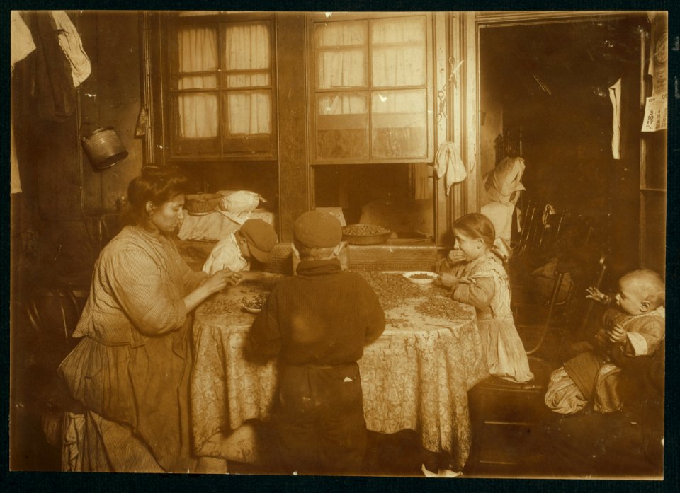 Mrs. Raphael Marengin, (...) St., first floor rear. Pepine, 10 yrs. old, cracking nuts with her teeth. The mother had just been doing the same. Carmine, 8 years old, has cross eyes, and with LOC cph.3a39222