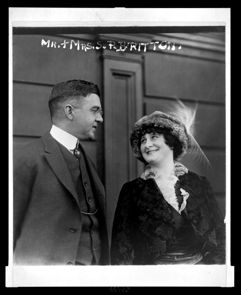 Mrs. Schuyler Britton, owner of the St. Louis Cardinals, and her husband, half-length, conversing LCCN2003689091