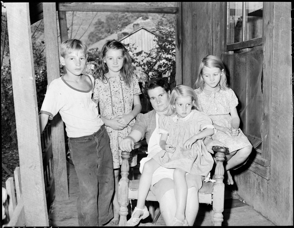 Mrs. Tommy Fisher and her children. Her husband was killed in a mine explosion last December. She has received no... - NARA - 541206
