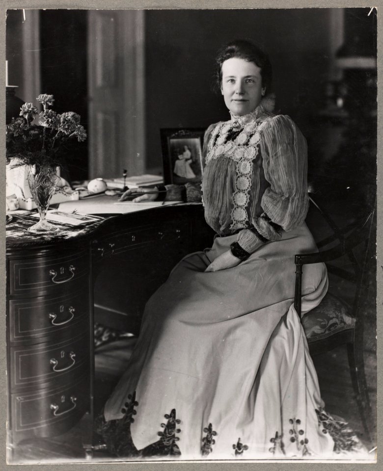 Mrs. Theodore Roosevelt, three-quarters length portrait, seated at desk, facing forward LCCN96525604