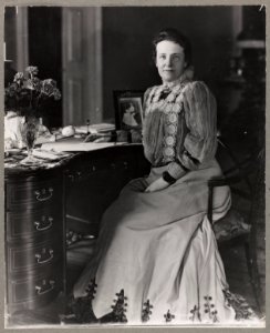 Mrs. Theodore Roosevelt, three-quarters length portrait, seated at desk, facing forward LCCN96525604
