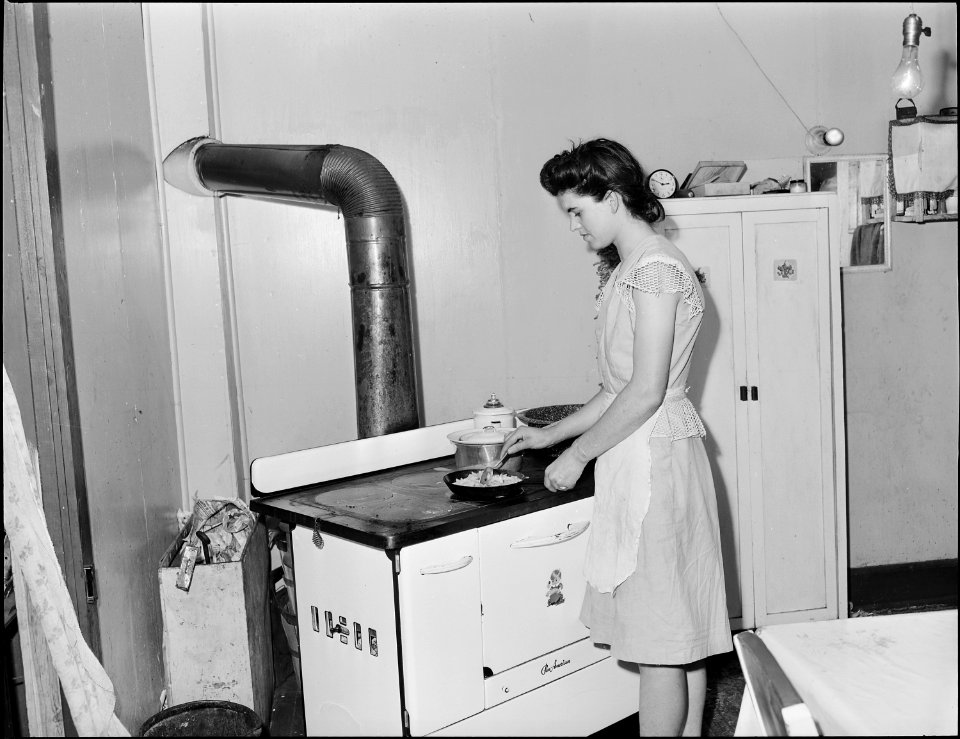 Mrs. Tommy Swafford in the kitchen of her four room house. Panther Red Ash Coal Corporation, Douglas Mine, Panther... - NARA - 541007
