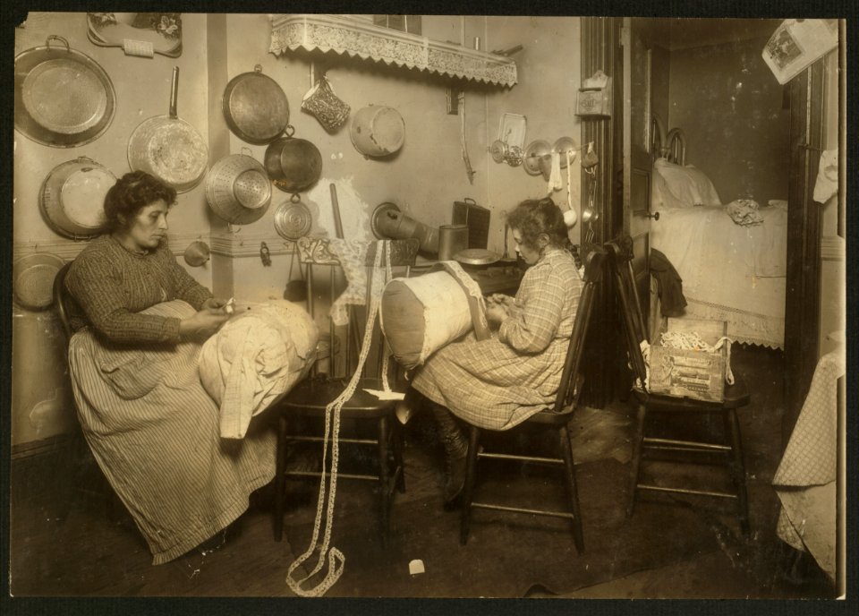 Mrs. Palontona and 13 year old daughter, Michaeline, working on 'Pillow-lace' in dirty kitchen of their tenement home, 213 E. 111th Street, 3rd floor. They were both very illiterate. Mother LOC cph.3a29806