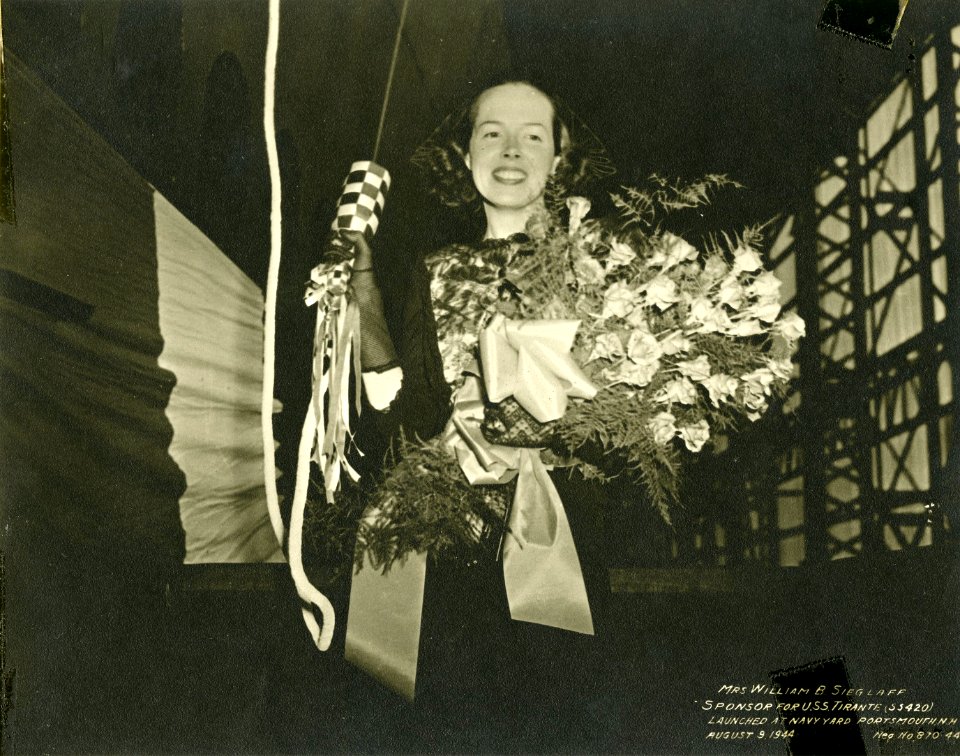 Mrs. Sieglaff posed with champagne for christening USS Tirante (SS 420)