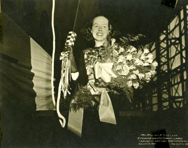 Mrs. Sieglaff posed with champagne for christening USS Tirante (SS 420)