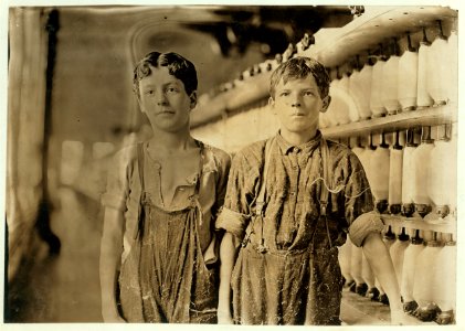 Mule-spinning room in Chace Cotton Mill, Burlington, Vt. Left hand-Leopold Daigneau, Arsene Lussier, 'Back-roping boys.' See photo and label -730. LOC cph.3b24163