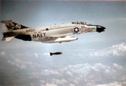McDonnell F-4B Phantom II of VF-161 drops M117 bomb over Vietnam, circa in 1970