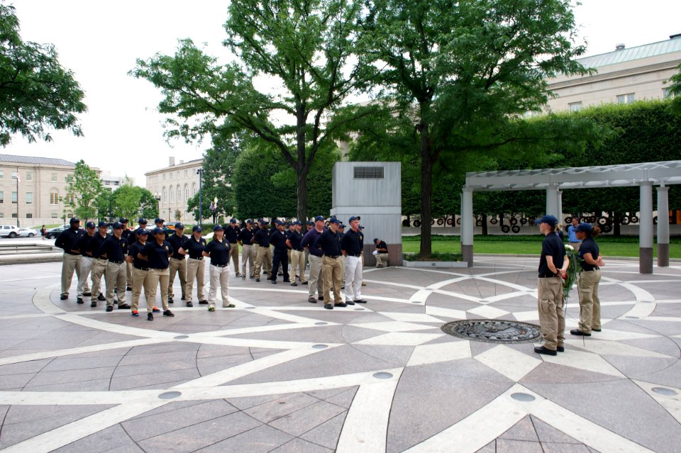 Multiple law enforcement explorers stand at attention at the National Law Enforcement Officers Memorial
