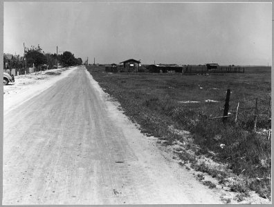 McFarland, Kern County, California. The McFarland shacktown lies to the left. This is the limit of p . . . - NARA - 521687 photo