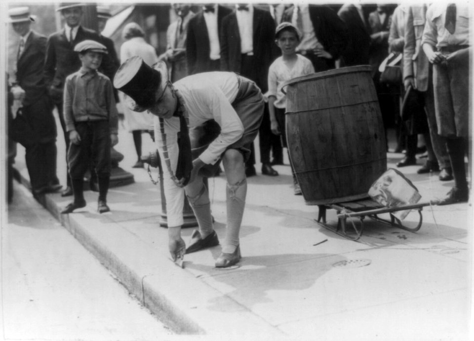 Measuring F Street in the National Capitol during the rush hours of the afternoon with a one foot rule, was the initiation stunt wished on this applicant for membership in a local college LCCN90708933