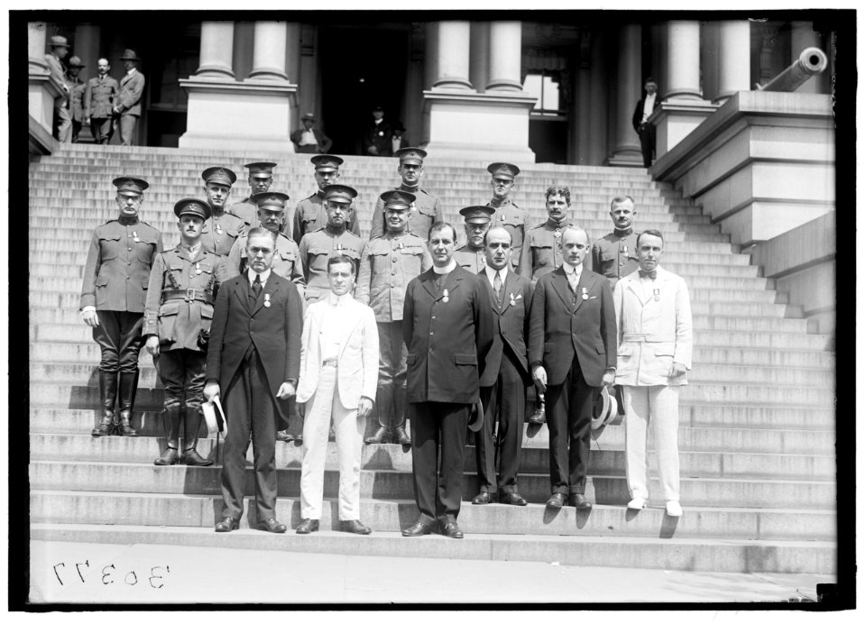 MEDALS, DECORATIONS, ETC. DR. MOTT; SEC. BAKER; FATHER JOHN BURKE; UNIDENTIFIED. OTHER ROWS ARE ARMY CHAPLAINS DECORATED LCCN2016870008