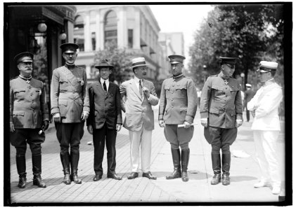 MEDALS, DECORATIONS, ETC. AMBASSADOR MACCHI DI CELLERE OF ITALY DECORATING U.S. ARMY OFFICERS; GEN. MARCH AND SEC. BAKER, LEFT CENTER LCCN2016870240
