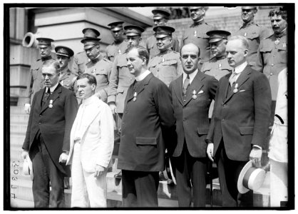 MEDALS, DECORATIONS, ETC. DR. MOTT; SEC. BAKER; FATHER JOHN BURKE; UNIDENTIFIED. OTHER ROWS ARE ARMY CHAPLAINS DECORATED LCCN2016870005