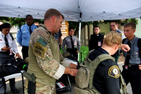Medic adjusts vest on law enforcement explorer