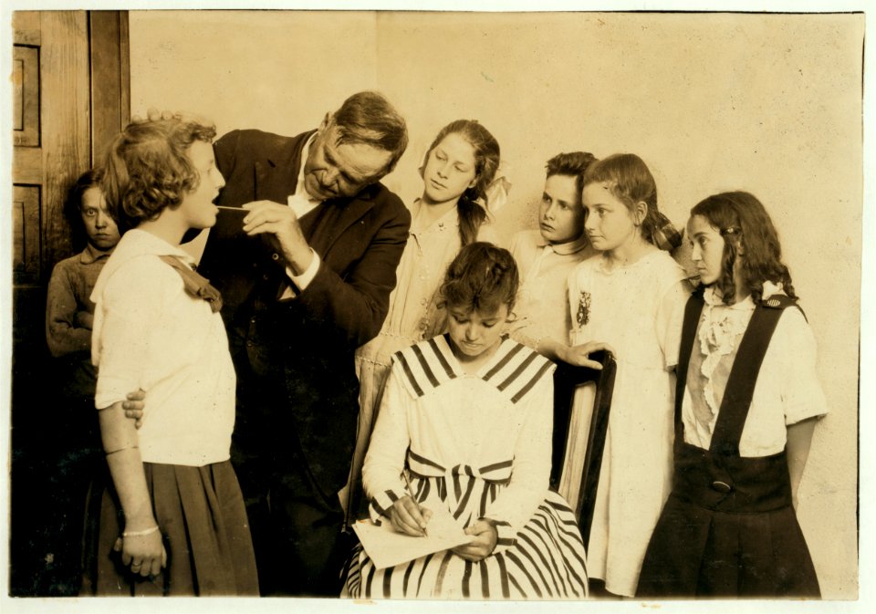Medical inspection and examining throats in Grade 6 of Washington School. LOC nclc.00669