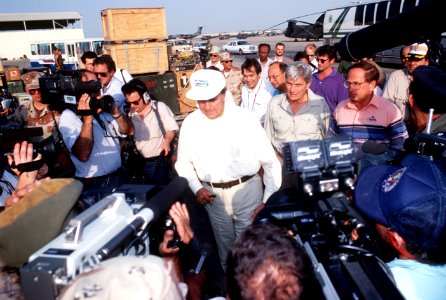 Media personnel crowd around Robert Dole, John Warner, and Sam Nunn