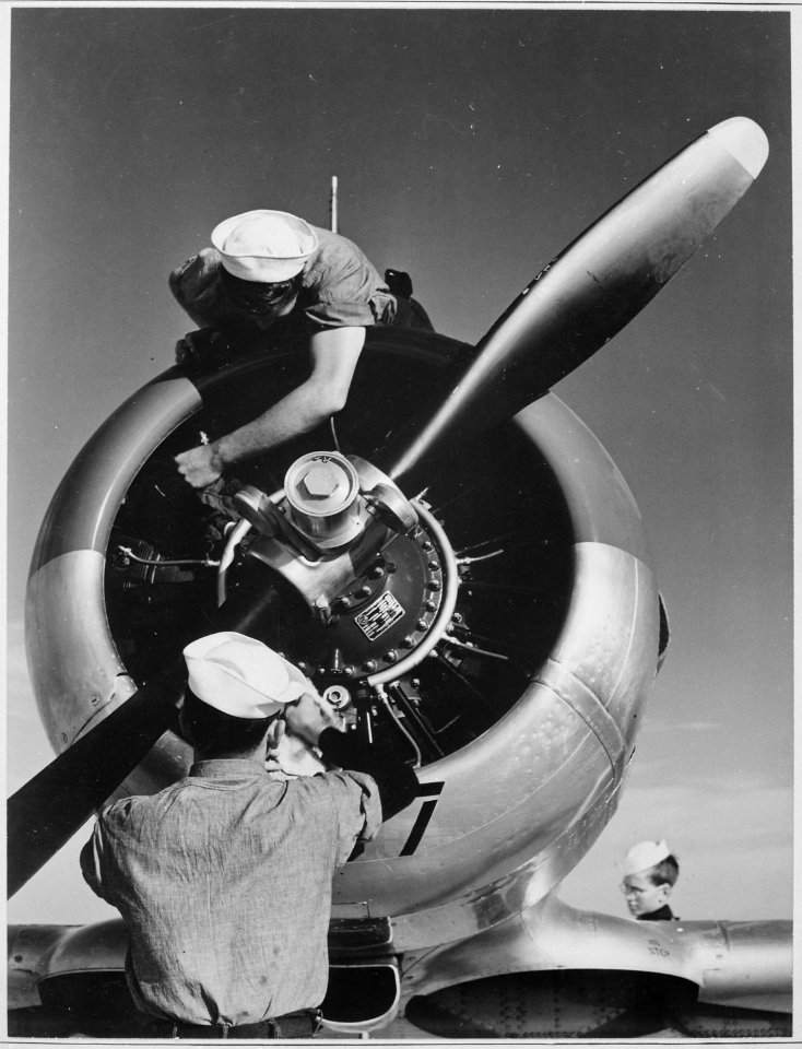 Mechanics check engine of SNJ at Kingsville Field, NATC, Corpus Christi, Texas. - NARA - 520974
