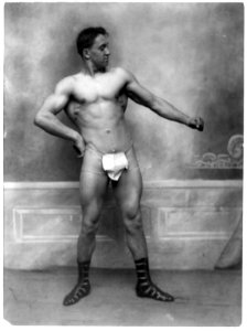 Muscular man wearing only fig leaf-shaped cloth and Roman sandals LCCN91795908
