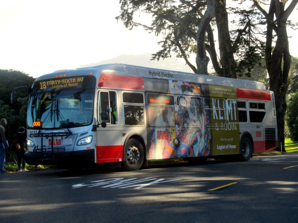 Muni route 18 bus with The Maiden ad at Legion of Honor, January 2018