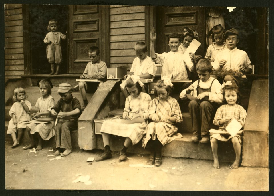 Myrtle. A typical sight. Family and neighbors working on tags on door steps of Mrs. --. See report. LOC nclc.05499
