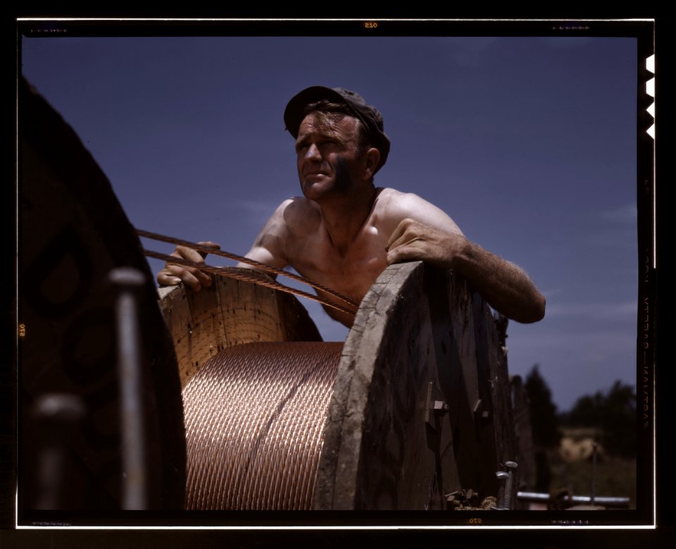 Member of a crew building a new 33000-volt electric power line into Fort Knox (1942-06)