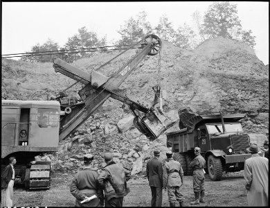 Members of Medical Survey Gorup watch shovel in operation loading overburden onto truck. The St. Clair Coal Company... - NARA - 541529