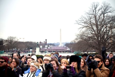 Members of the crowd watch President Barack Obama's Inauguration Day speech in Washington, D.C., January 21, 2013